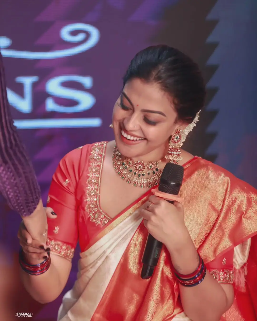 Anusree Nair Wearing Beautiful Earrings Jewellery White Saree Orange Blouse